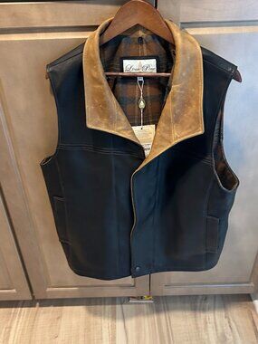 LONE PINE, MOUNTAIN HIGH LEATHER VEST, BLACK WITH BROWN TRIM AND PLAID LINING